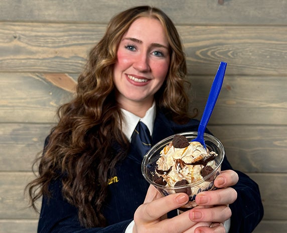 An FFA Member holding up the new Scoops of Thanks Day Flavor of the Day.